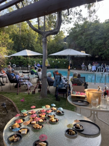 Beautiful pool area at The Oaks of Pasadena independent senior living community, ideal for evening gatherings and special events
