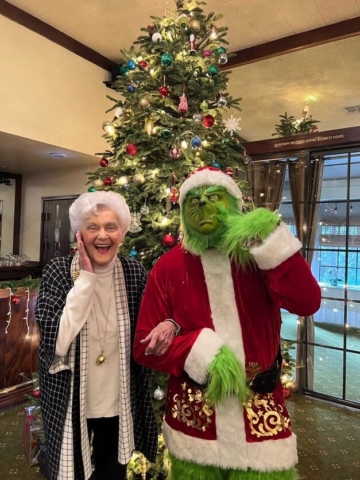 The Grinch pays a visit to The Oaks of Pasadena senior independent apartments every Christmas