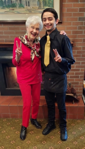 Residents and staff at The Oaks of Pasadena senior living community enjoying friendly interactions and a warm, welcoming atmosphere.