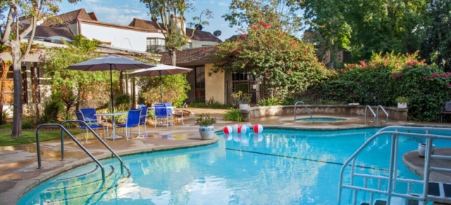 Residents and guests may access the pool and jacuzzi at The Oaks of Pasadena right next to the restaurant dining room and library