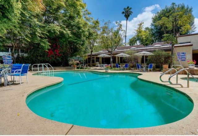Outdoor heated pool at The Oaks of Pasadena senior living community, available year-round for resident enjoyment