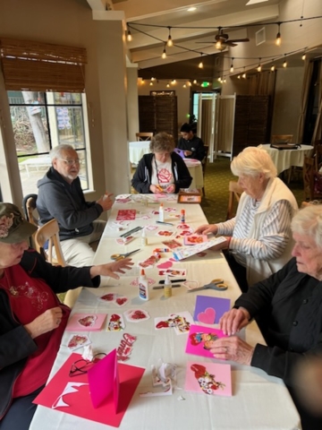 Residents at The Oaks of Pasadena senior living community participating in the annual Valentine’s Day card-making activity, celebrating creativity and connection.