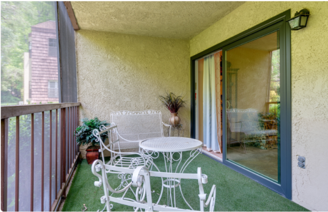 Studio apartment at The Oaks of Pasadena senior living community, featuring a screened-in patio for private outdoor enjoyment — recognized as a Top Senior Facility in 2024 by L.A. Magazine