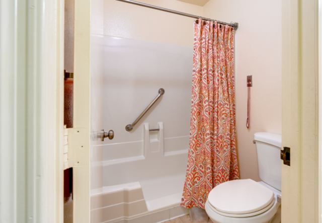Safety-focused design at The Oaks of Pasadena senior living community, with emergency pull cords installed in bathrooms and bedrooms to summon staff assistance when needed